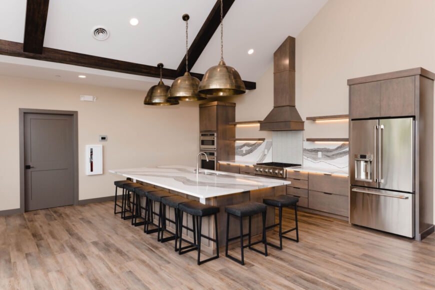 Siesta Hills clubhouse gourmet kitchen with large island and seating in Mankato Minnesota