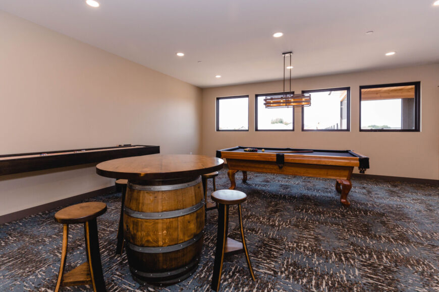 Siesta Hills clubhouse game room with bar seating and pool table area in Mankato Minnesota