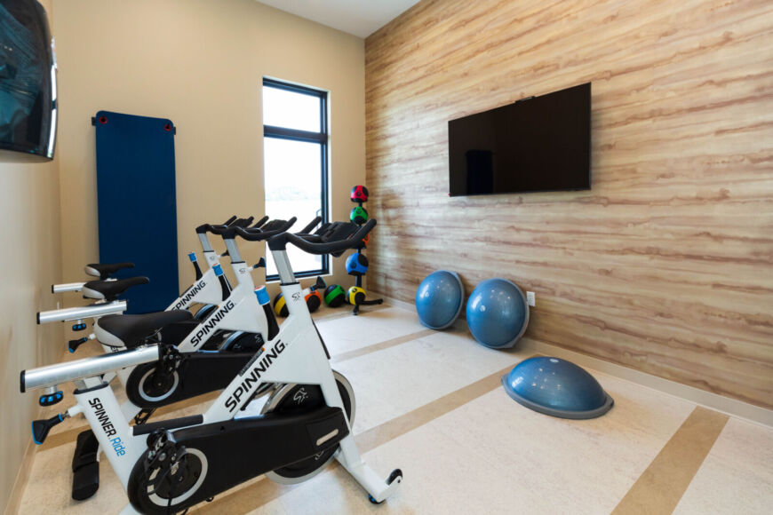 Spin bikes and yoga exercise area inside the Siesta Hills clubhouse fitness center in Mankato Minnesota