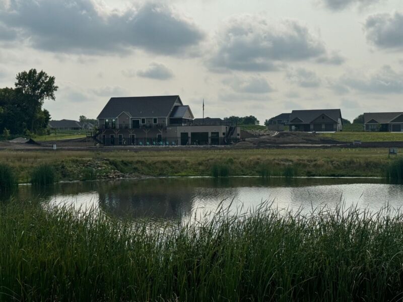 Siesta Hills clubhouse and pond view in Mankato Minnesota showing community layout and natural setting