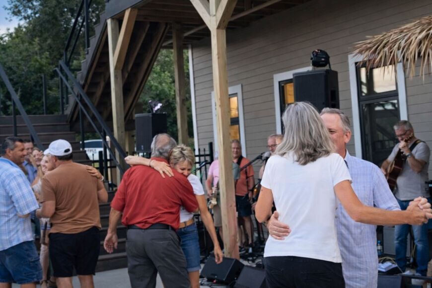 Outdoor community gathering with live music and neighbors dancing at Siesta Hills in Mankato Minnesota