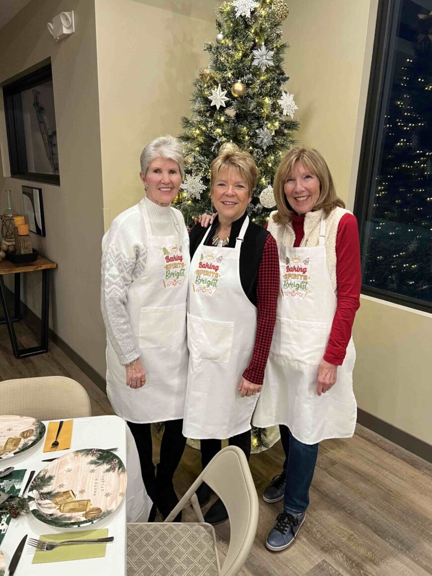 Siesta Hills Mankato residents enjoying holiday event with decorated Christmas tree and community gathering indoors