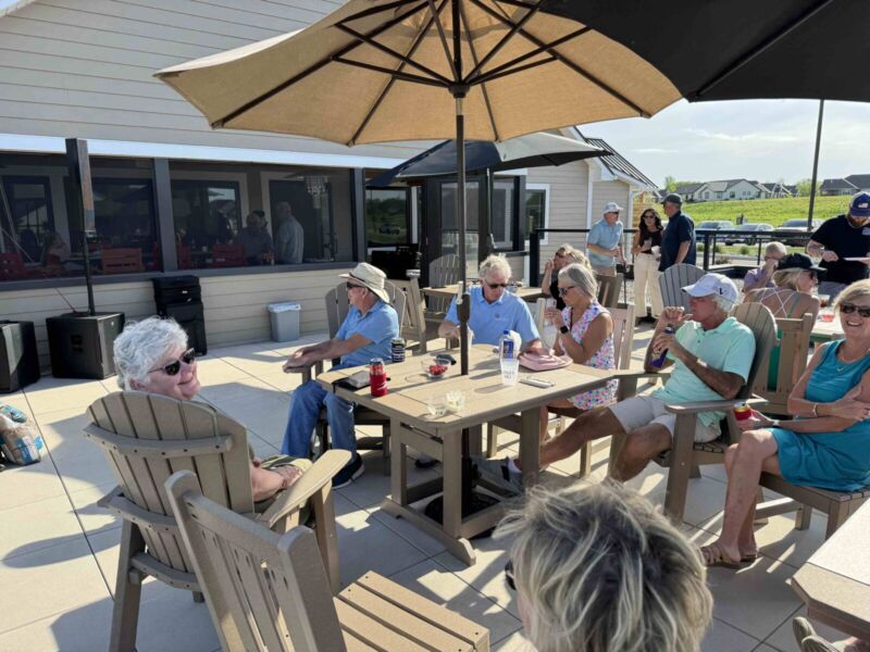 Residents enjoying a summer patio gathering at the Siesta Hills clubhouse in Mankato Minnesota