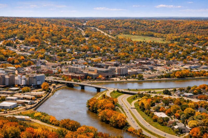 Aerial view of Mankato Minnesota showing downtown skyline, Minnesota River, bridges, and surrounding residential neighborhoods in southern Minnesota.