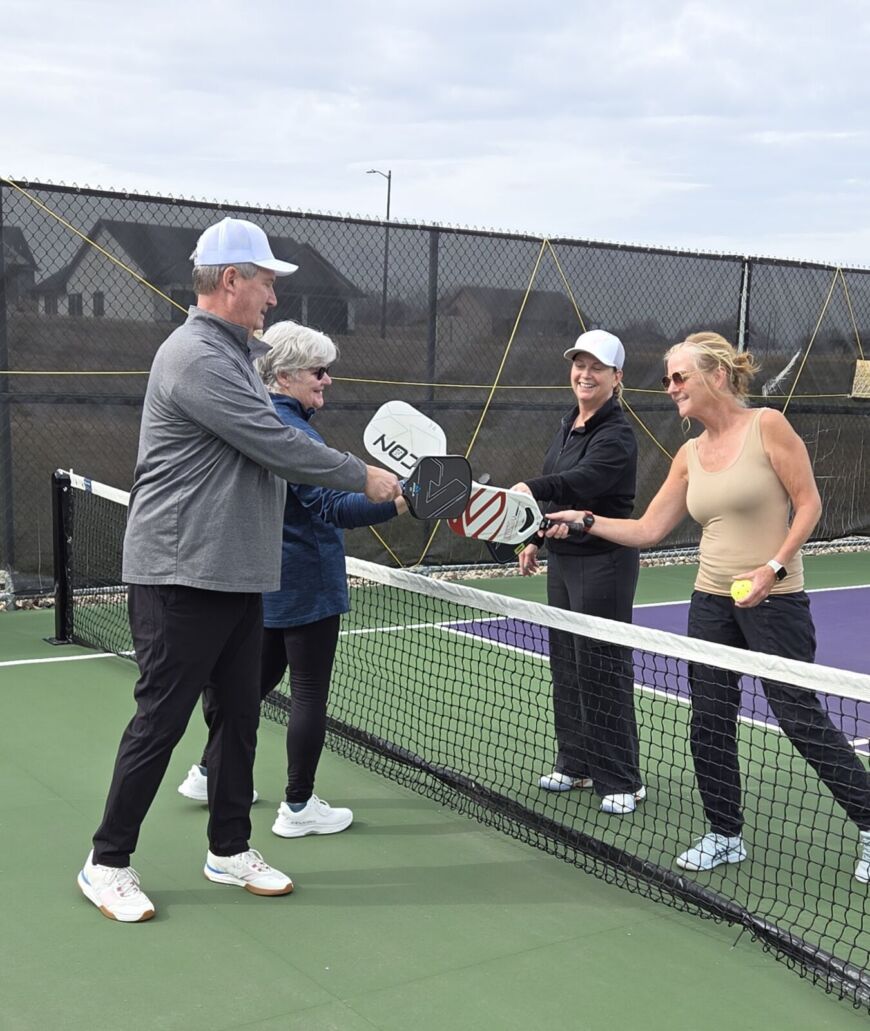 Residents playing pickleball at the Siesta Hills outdoor courts in Mankato Minnesota