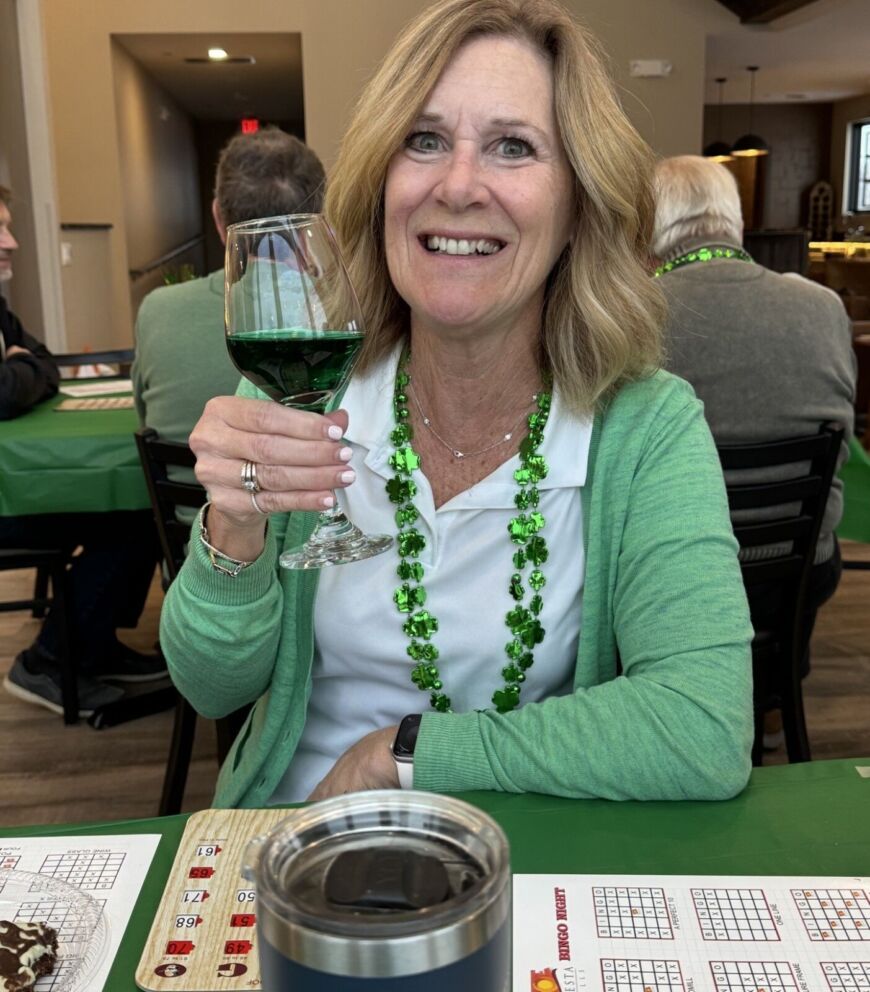 Resident celebrating St. Patrick&rsquo;s Day bingo night at Siesta Hills in Mankato Minnesota