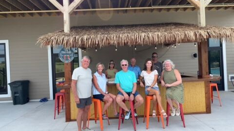 Residents enjoying a tiki-themed social gathering at Siesta Hills in Mankato Minnesota