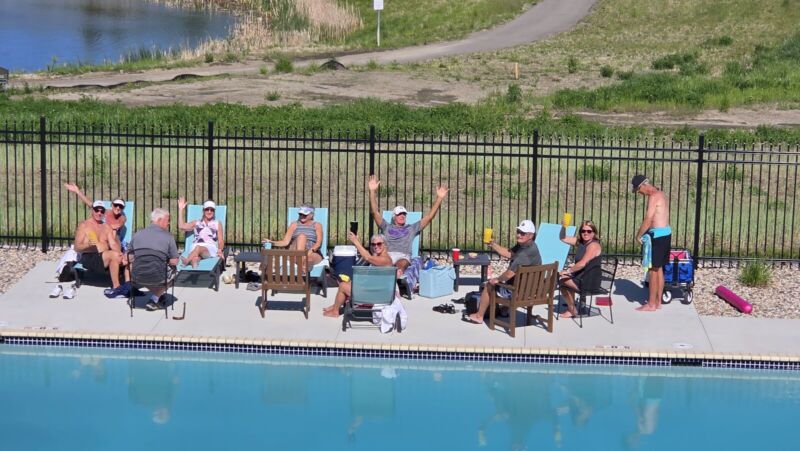 Residents enjoying the outdoor pool during Memorial Day weekend at Siesta Hills clubhouse in Mankato, Minnesota.