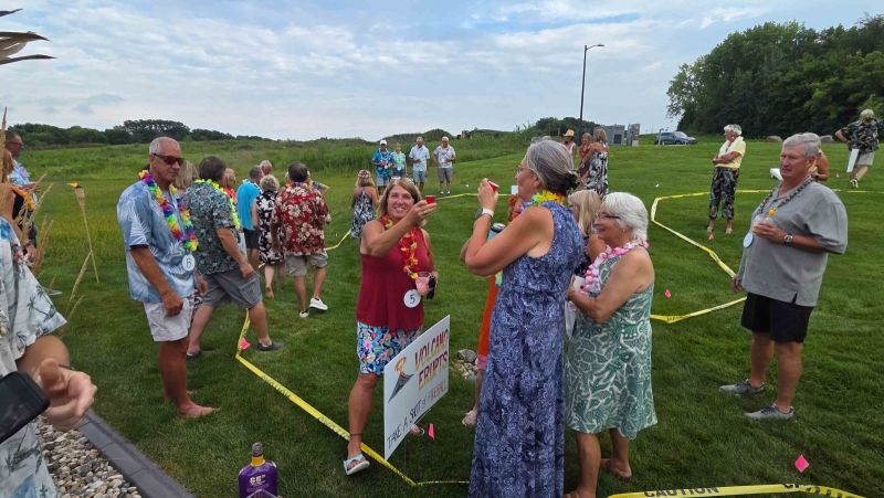 Siesta Hills neighbors enjoying outdoor games together on the community lawn