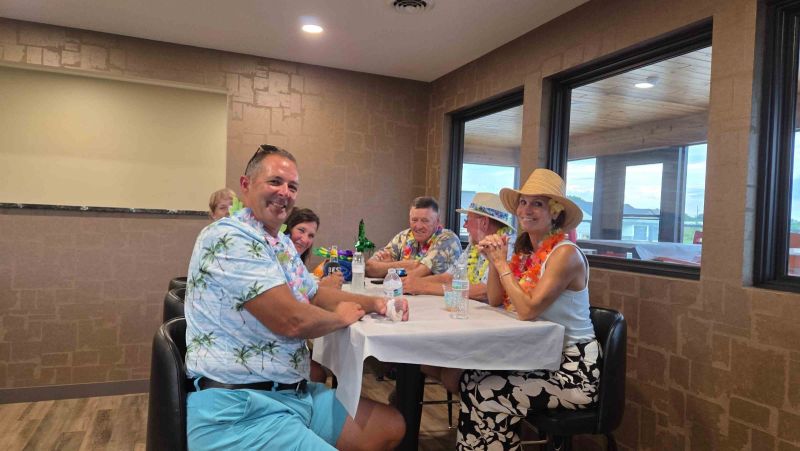 Siesta Hills neighbors visiting together inside the community clubhouse